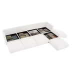 Canapé modulable avec rangement, dossier cylindrique et accoudoirs, assise profonde et confortable, durable et offrant un bon soutien pour le salon.