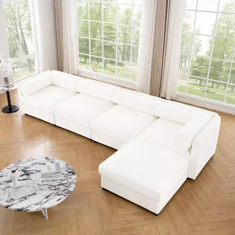 Canapé modulable avec rangement, dossier cylindrique et accoudoirs, assise profonde et confortable, durable et offrant un bon soutien pour le salon.