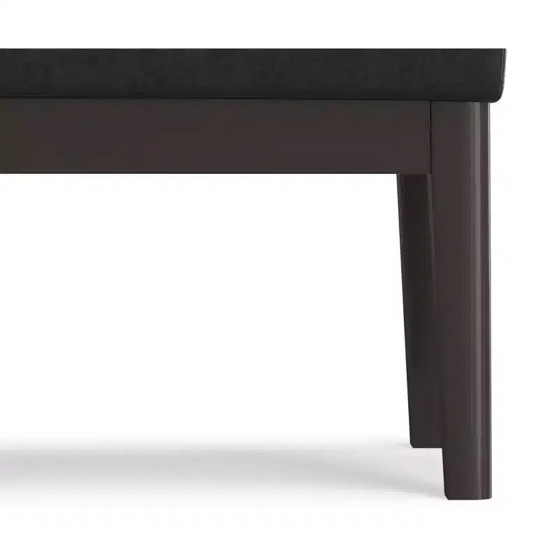 Banc repose-pieds étroit Bragg de 68,5 cm de large, style Mid-Century, en similicuir végan vieilli noir
