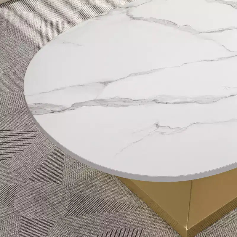 Table basse à plateau en céramique avec piètement contemporain en acier inoxydable - Une pièce maîtresse durable et élégante pour votre salon.