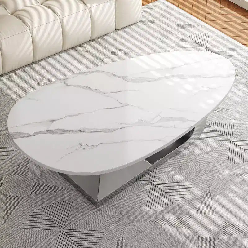 Table basse à plateau en céramique avec piètement contemporain en acier inoxydable - Une pièce maîtresse durable et élégante pour votre salon.