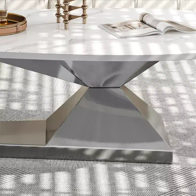 Table basse à plateau en céramique avec piètement contemporain en acier inoxydable - Une pièce maîtresse durable et élégante pour votre salon.