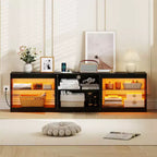 Meuble TV Costway avec prises de courant, lumières LED réglables et placard de rangement pour téléviseurs jusqu'à 85 pouces, noir/blanc