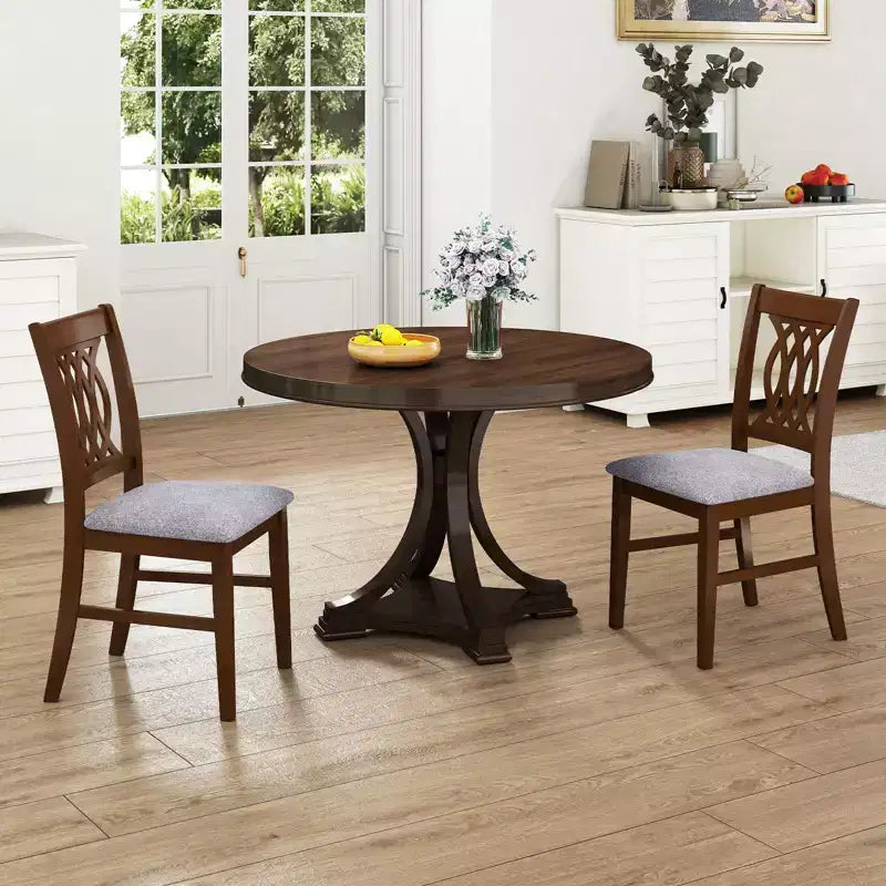 Lot de 4 chaises de salle à manger Costway avec assise rembourrée, dossier ajouré et cadre en bois d'hévéa