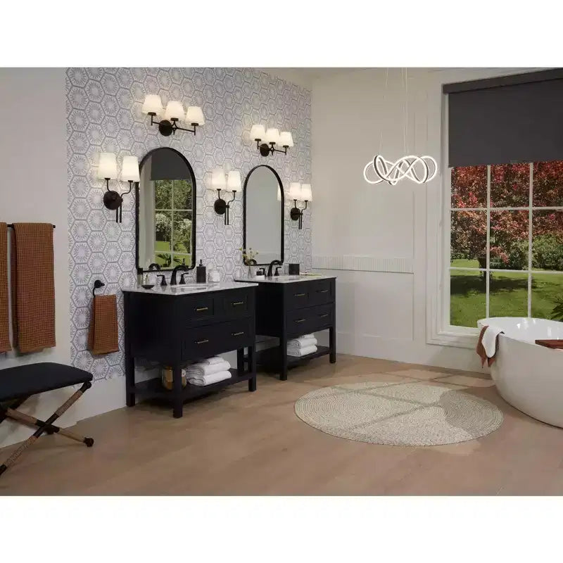 Miroir mural décoratif Clara Arch Top Vanity de Uttermost, biseauté, cadre en métal noir mat, 61 cm de large, pour salle de bain, chambre à coucher, salon, entrée.